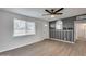 Bright living room with a ceiling fan, and natural light from a large window at 148 N Glenview --, Mesa, AZ 85213