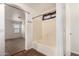 This bathroom has a bathtub with tile surround, a shower curtain, and access to the bedroom at 15466 W Shangri La Rd, Surprise, AZ 85379