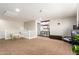 Bright bonus room featuring carpeted floors, versatile layout, and neutral-toned walls at 16993 W Shiloh Ave, Goodyear, AZ 85338