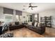 Living room with sliding glass doors, neutral decor, tile floors and view of the backyard at 16993 W Shiloh Ave, Goodyear, AZ 85338