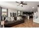 Spacious living room open to the kitchen, featuring tile floors and neutral decor at 16993 W Shiloh Ave, Goodyear, AZ 85338