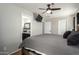 Main bedroom showing ceiling fan and en-suite bathroom at 16993 W Shiloh Ave, Goodyear, AZ 85338