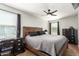 Main bedroom featuring a ceiling fan, a large window, and ample space at 16993 W Shiloh Ave, Goodyear, AZ 85338