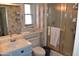 Cozy bathroom featuring a walk-in shower and vanity sink at 17626 N Buntline Dr, Sun City West, AZ 85375