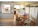 Inviting dining area with a round table, natural light, and views into kitchen at 17626 N Buntline Dr, Sun City West, AZ 85375