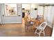 Dining area with laminate floors connects to kitchen and additional living spaces at 17626 N Buntline Dr, Sun City West, AZ 85375