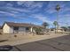 Single story home featuring low maintenance landscaping, two-car garage, and desert landscape at 17626 N Buntline Dr, Sun City West, AZ 85375