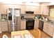 Bright kitchen with stainless steel appliances, light wood cabinetry, and laminate countertops at 17626 N Buntline Dr, Sun City West, AZ 85375