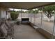 Enclosed patio featuring outdoor furniture, a privacy screen, and a pleasant view at 17626 N Buntline Dr, Sun City West, AZ 85375