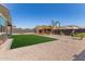 Expansive backyard boasting low-maintenance landscaping, modern pergola, and desert charm at 1781 S 223Rd Dr, Buckeye, AZ 85326