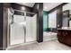 Bathroom featuring shower, bathtub, and black accent wall at 1781 S 223Rd Dr, Buckeye, AZ 85326