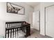 Bedroom with soft carpet, white walls, a crib, and a neutral animal art print at 1781 S 223Rd Dr, Buckeye, AZ 85326