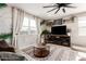 Relaxing living room with large windows, stylish decor, and comfortable seating at 1781 S 223Rd Dr, Buckeye, AZ 85326