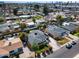 Aerial view of a residential neighborhood with lush landscaping, mature trees, and well-kept homes at 1837 E Coolidge St, Phoenix, AZ 85016