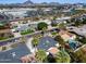 Overhead view of the neighborhood featuring manicured lawns, mature trees, and nearby commercial area at 1837 E Coolidge St, Phoenix, AZ 85016