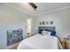 Comfortable bedroom featuring a blue and white color scheme, light wood floors, and a book rack at 1837 E Coolidge St, Phoenix, AZ 85016