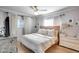 Cozy bedroom with light hardwood floors, lots of pillows, and bright natural lighting at 1837 E Coolidge St, Phoenix, AZ 85016