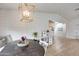 Dining area with wood floors features shiplap walls and a modern light fixture, combining style and function at 1837 E Coolidge St, Phoenix, AZ 85016