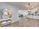 Elegant entryway showcasing an open floor plan with a kitchen and living room in the background at 1837 E Coolidge St, Phoenix, AZ 85016