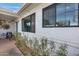 Exterior of home with well-maintained stone walkway, covered porch, and manicured landscaping at 1837 E Coolidge St, Phoenix, AZ 85016