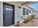 Charming front entrance with a stylish door, lantern and well-maintained stonework at 1837 E Coolidge St, Phoenix, AZ 85016