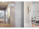 Hallway with bright white trim and doors, hardwood floors, and a built-in shoe rack at 1837 E Coolidge St, Phoenix, AZ 85016