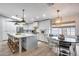 Modern kitchen with a large island, stainless steel appliances, and stylish pendant lighting fixtures at 1837 E Coolidge St, Phoenix, AZ 85016