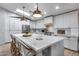 Bright kitchen with island, white countertops, modern appliances, and a skylight provides tons of natural light at 1837 E Coolidge St, Phoenix, AZ 85016