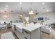 Open concept kitchen features an oversized island with bar seating connecting it to the living area at 1837 E Coolidge St, Phoenix, AZ 85016