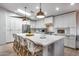 Bright kitchen with island features white cabinetry, seating, modern appliances, and a stylish design at 1837 E Coolidge St, Phoenix, AZ 85016