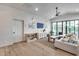 Bright living room with shiplap walls, a cozy sofa, and natural light from large windows at 1837 E Coolidge St, Phoenix, AZ 85016