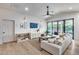 Beautiful living room with a sofa and natural light streaming from the large glass windows at 1837 E Coolidge St, Phoenix, AZ 85016