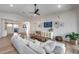 Living room with shiplap, open floor plan, light wood floors, and natural light from a glass door at 1837 E Coolidge St, Phoenix, AZ 85016