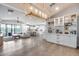 Bright living room with hardwood floors, stylish decor, and an open layout leading to the kitchen at 1837 E Coolidge St, Phoenix, AZ 85016