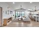 Spacious living room featuring shiplap walls, modern furniture, and large sliding glass doors at 1837 E Coolidge St, Phoenix, AZ 85016