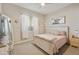 Bright bedroom featuring a ceiling fan, a decorative painting, and an updated bed set at 18501 W Galveston St, Goodyear, AZ 85338