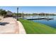 Community lake with a dock, gazebo, and manicured landscaping at 18501 W Galveston St, Goodyear, AZ 85338