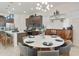 Dining area adjacent to kitchen, featuring a modern table setting and stylish decor at 18501 W Galveston St, Goodyear, AZ 85338