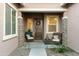 Inviting front porch with decorative wreath and seating area at 18501 W Galveston St, Goodyear, AZ 85338