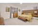 Bright main bedroom featuring a unique wooden headboard and comfortable, modern furnishings at 18501 W Galveston St, Goodyear, AZ 85338