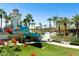 Community water park with a lighthouse, slides, and seating areas at 18501 W Galveston St, Goodyear, AZ 85338