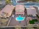 Expansive aerial view of a backyard featuring a sparkling pool and a well-maintained outdoor area, perfect for relaxation at 19259 N Ventana Ln, Maricopa, AZ 85138