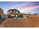 A private backyard features a refreshing pool, patio seating, and drought-resistant landscaping at 19259 N Ventana Ln, Maricopa, AZ 85138