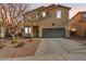 Charming two-story home with a two-car garage, complemented by a well-maintained front yard at 19259 N Ventana Ln, Maricopa, AZ 85138