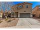 Charming two-story home with a well-maintained front yard and a two-car garage at 19259 N Ventana Ln, Maricopa, AZ 85138