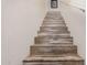 Wood staircase with white walls and handrail at 19259 N Ventana Ln, Maricopa, AZ 85138