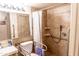 Accessible bathroom with a tiled shower, safety bars, grab bars, and ample lighting at 1926 E El Moro Ave, Mesa, AZ 85204