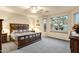 Serene main bedroom with a large window, ceiling fan, and ample space for relaxation and rest at 20207 N Riverbank Rd, Maricopa, AZ 85138