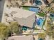 An aerial view of a stunning home showcasing a pool, basketball court, and beautiful landscaping at 21432 N 77Th Pl, Scottsdale, AZ 85255