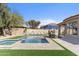 Large backyard includes a pool, hot tub, lounge seating, and dining area for outdoor enjoyment at 21432 N 77Th Pl, Scottsdale, AZ 85255